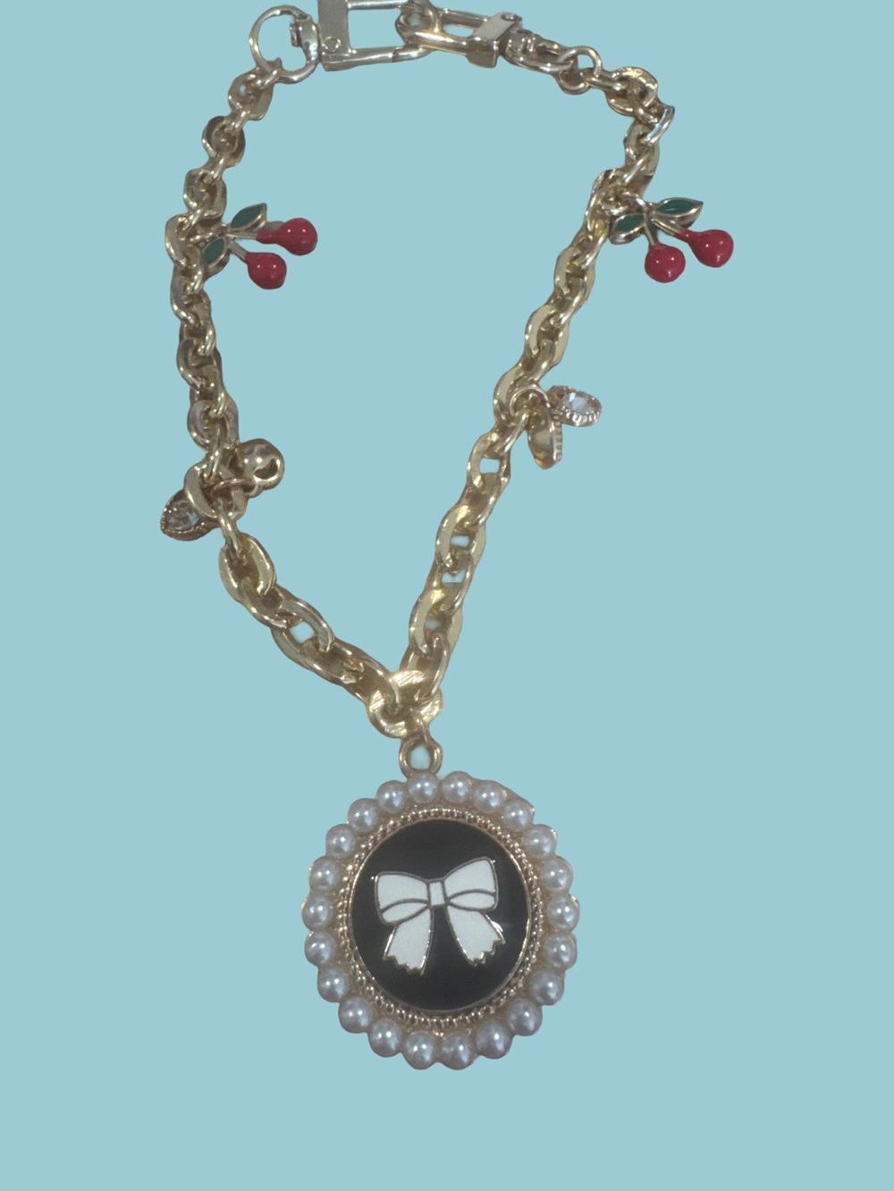 Gold Tone Pearl-Trim Black Bow Pendant bag charm